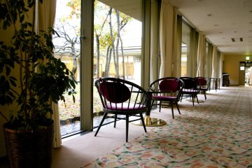 <p>Tea tables by the window right next to the lobby</p>