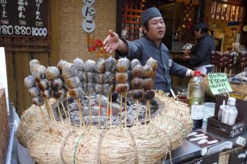 There are various locations selling food, drinks, and traditional Japanese snacks.