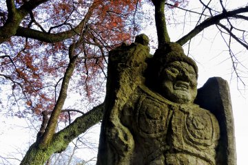 <p>Statue of Fudo-Myo-O standing beside the Prayer Path in Nishiyama Park</p>