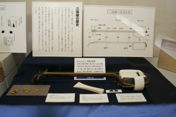 <p>The shamisen, a three stringed Japanese musical instrument played with a plectrum called 'bachi'</p>