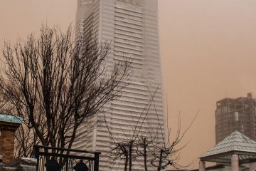 The sky's brownish color is actually red sand from China!