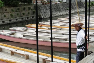 <p>A boatman waits for tourists</p>
