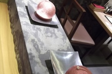 <p>Ornaments decorate the partitions between tables</p>