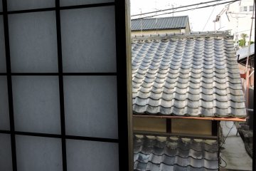 <p>View of the tiled roofs of old Kyoto town houses</p>
