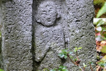 <p>The carving at the bottom of one of the garden's lanterns, indicating the garden owner was a hidden Christian</p>