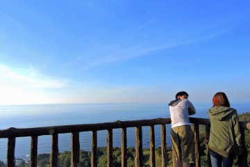 <p>A couple enjoying the magnificent view from the observation deck on a sunny autumn day</p>
