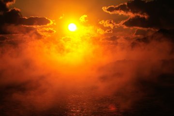 Sea fog like steam rising from hot water