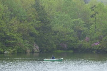 I stopped walking, trying to catch the sound of a fisherman casting his line, but it seemed to be absorbed by the mystic foggy rain. 