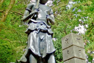 <p>A deity with its sword drawn, ready to banish any evil doer</p>