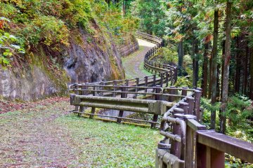 <p>Some sections of the trail follow a long paved road which winds around several mountain valleys</p>