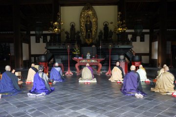 <p>Kneeling in prayer</p>