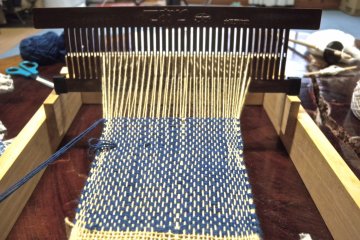 Weaving the yarn to make my mug coaster