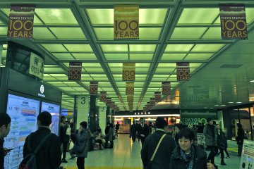 <p>Commuters passing through Tokyo Station during the 100th Anniversary celebration</p>
