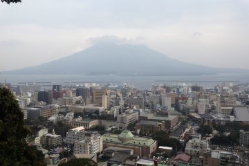 A cloud-covered Sakurajima as viewed from the Shiroyama Lookout in Kagoshima