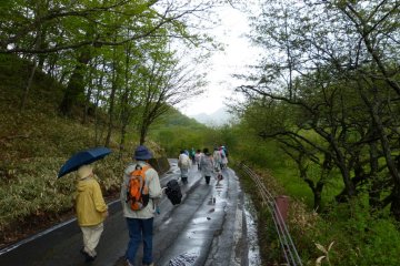 Hiking along the road. Every now and then there are bus stops and restrooms and place to sit for a while