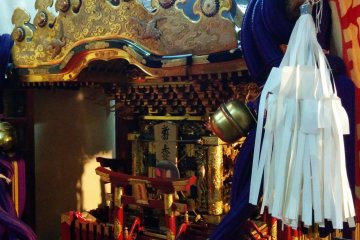 <p>A portable shrine resting to the right of the entrance of the great hall</p>