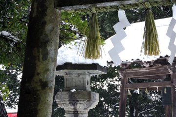 <p>Looking up at the stone torii gate from inside</p>