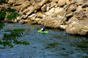 <p>Lone kayaker in a tiny kayak</p>
