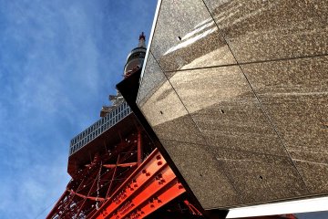 A different view of the tower between the leg of the tower and the building at the base of it.&nbsp;
