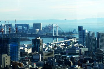 You can see the Tokyo bay area from the viewing space including Rainbow Bridge and on the left side the Fuji Television building.&nbsp;