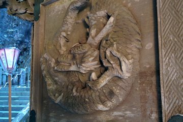 <p>One of the carved dragons on the doors of the 'two dragons gate'</p>