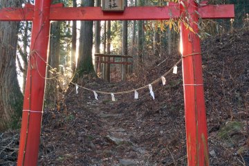 <p>Age-old archways/gates lead you off the stone path</p>