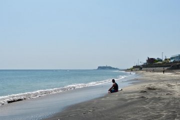 A surfer taking a break from the waves.