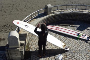A surfer checking out the waves.