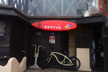 You can rent boards and bikes at this surf shop.