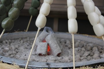 <p>Mochi (rice cakes) on sticks</p>