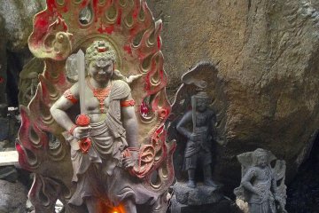 Just a glimpse of a few of the hundreds of statues that adorn this site. Many are lit with candles and incense. These are situated just outside a cave you can enter and pass through.