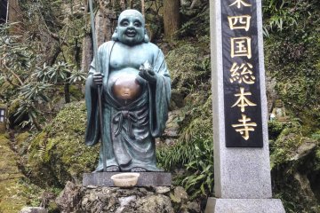 A statue of Hotei, the deity of happiness and contentment.