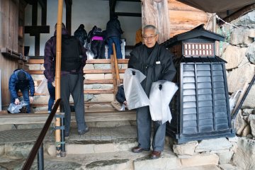 Visitors must remove their shoes and wear slippers (or just your socks) before they can proceed with the tour