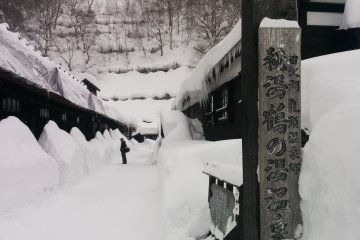 <p>The entrance to the small village. Some snow trekking is required to reach the end of the row of houses</p>