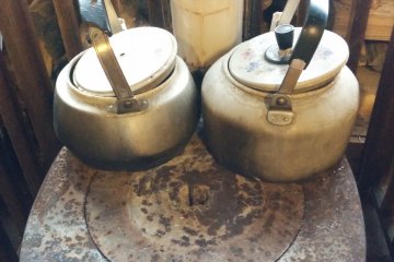 <p>Boiling water on a wood furnace in the rest lodge</p>