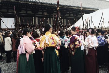 <p>Waiting for their turn to shoot the arrows.</p>