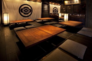 <p>A larger open space with leg wells below the tables</p>