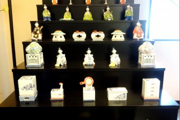 <p>A large tiered display of porcelain Hina&nbsp;dolls</p>