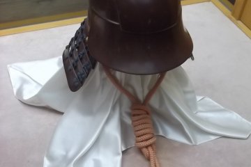 <p>A helmet on display</p>