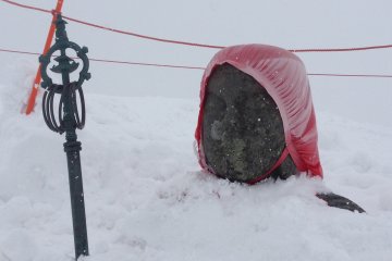 <p>We were lucky to see the Jizo on the second visit. The week before, this entire area was blocked off and the statue was completely covered with snow.</p>