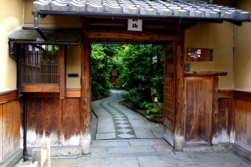 <p>Curved path leading from a covered gate</p>