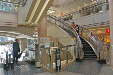 A unique, curved escalator at Landmark Tower shopping center.