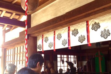 <p>People gather to ring the unconventional bell at the main shrine, and rub the statues for luck.</p>