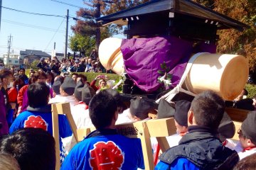 <p>The mikoshi is hoisted up by a group of men all aged 42, and carried with much excitement to the main shrine.</p>