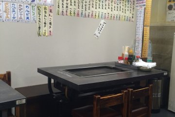 <p>Each table has its own grill allowing diners to cook their own meal.</p>
