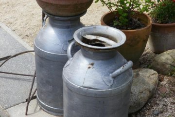 Milk cans outside Copio Gelato Shop