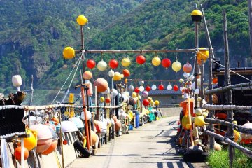 <p>One Iwayaguchi resident has created this colourful and ever-evolving sculpture out of the bits and pieces he collects along the coast.</p>
