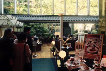 The restaurant tables are outside in the garden where the hotel has its own waterfall.