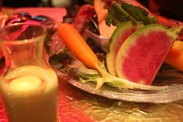 <p>Fresh vegetable variety plate with dressing</p>