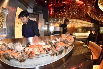 <p>Crab and shellfish displayed over ice</p>